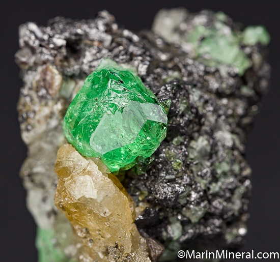 Tsavorite on Graphite from Merelani Hills, Arusha, Tanzania [db_pics/pics/K245c.jpg]
