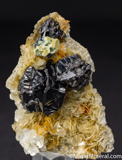 Kesterite, Cassiterite on Muscovite from Mt. Xuebaodig, Pinwu Co., Sichuan, China [db_pics/pics/M693a.jpg]