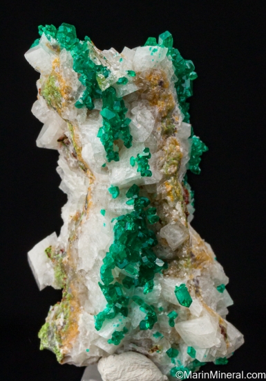 Dioptase on Calcite with Wulfenite from Tsumeb, Namibia [db_pics/pics/ST537b.jpg]