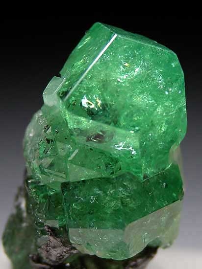 Tsavorite on Graphite from Merelani HIlls, Arusha Region, Tanzania [db_pics/pics/af542b.jpg]