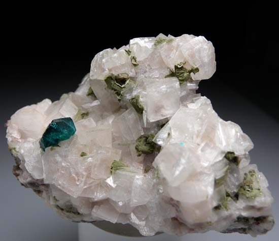 Dioptase on Calcite with Mottramite from Tsumeb, Namibia [db_pics/pics/b894b.jpg]