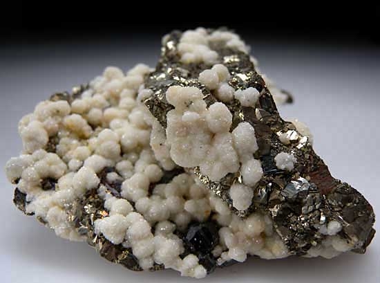 Dolomite, Galena, Sphalerite on Pyrite psuedo. Pyrrhotite from Trepca Mine, Stanterg, Kosovo [db_pics/pics/e598b.jpg]