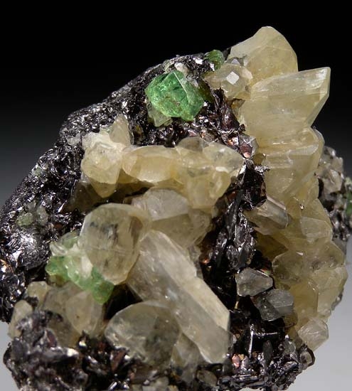 Tsavorite, Diopside on Graphite from Merelani Hills, Arusha, Tanzania [db_pics/pics/t553d.jpg]